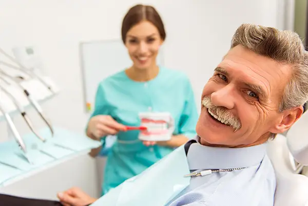 Man receiving dentures at Avery Dental Center 