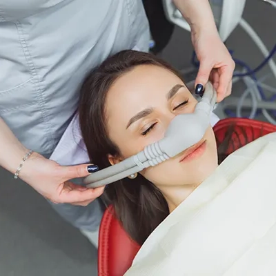 A woman receiving sedation dentistry