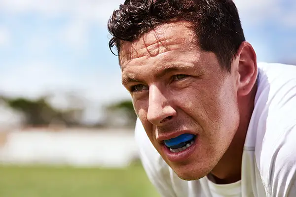 Man wearing sports guard from Avery Dental Center 