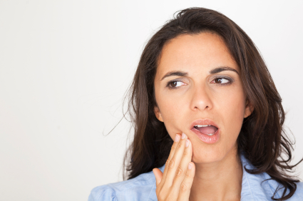 Woman holding her face with a toothache